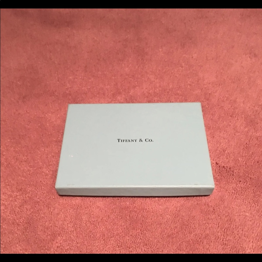 Tiffany & Company empty gift box. 
5 3/4”x4 3/8”x3/4” Classy elegant.